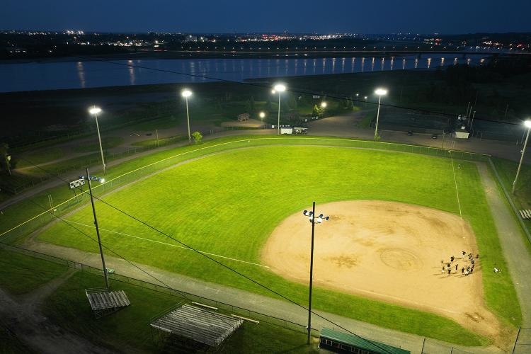 Drone view from above 3rd base line of powerful LED Lamps lighting Harold Page Field