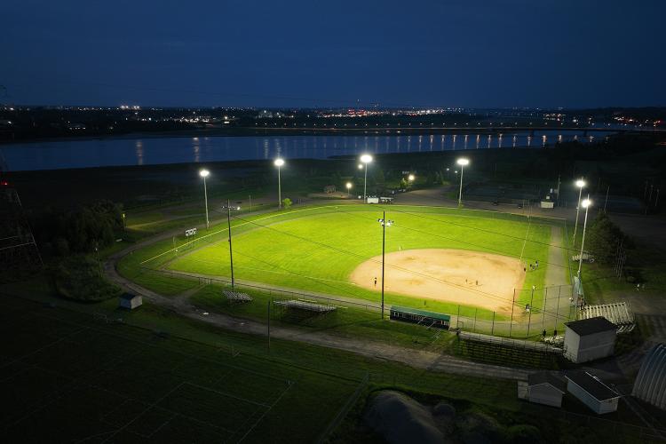 Distant drone view from above 3rd base line of Harold Page Field shows the excellent light cut off of the LED Lamps